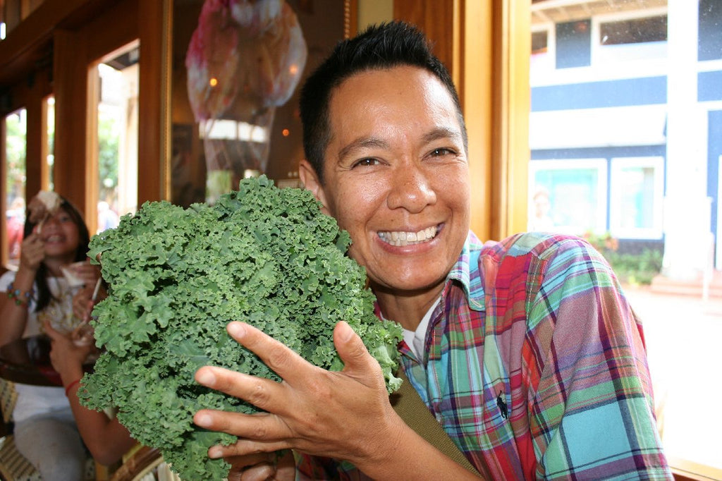 Dr. Chris Lipat holds a bouquet of kale